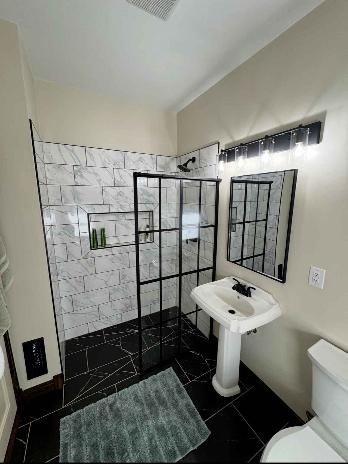 Bathroom after curbless shower tile, flooring, fixtures and lighting updates