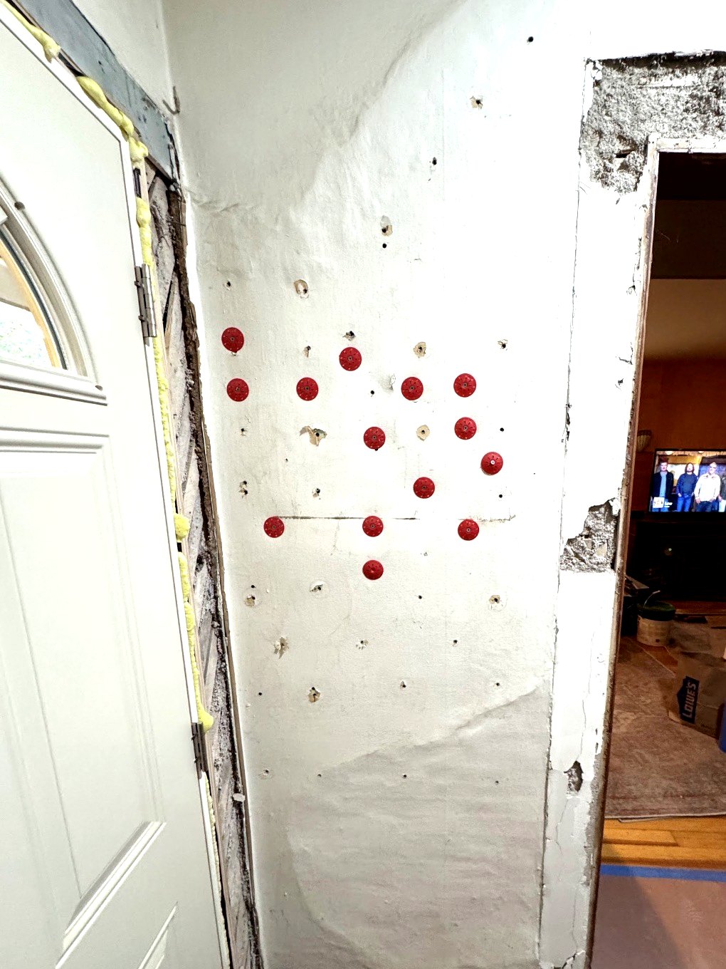 Damaged wall before repair